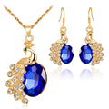 Parure de bijoux boucles d'oreilles et collier paon en strass