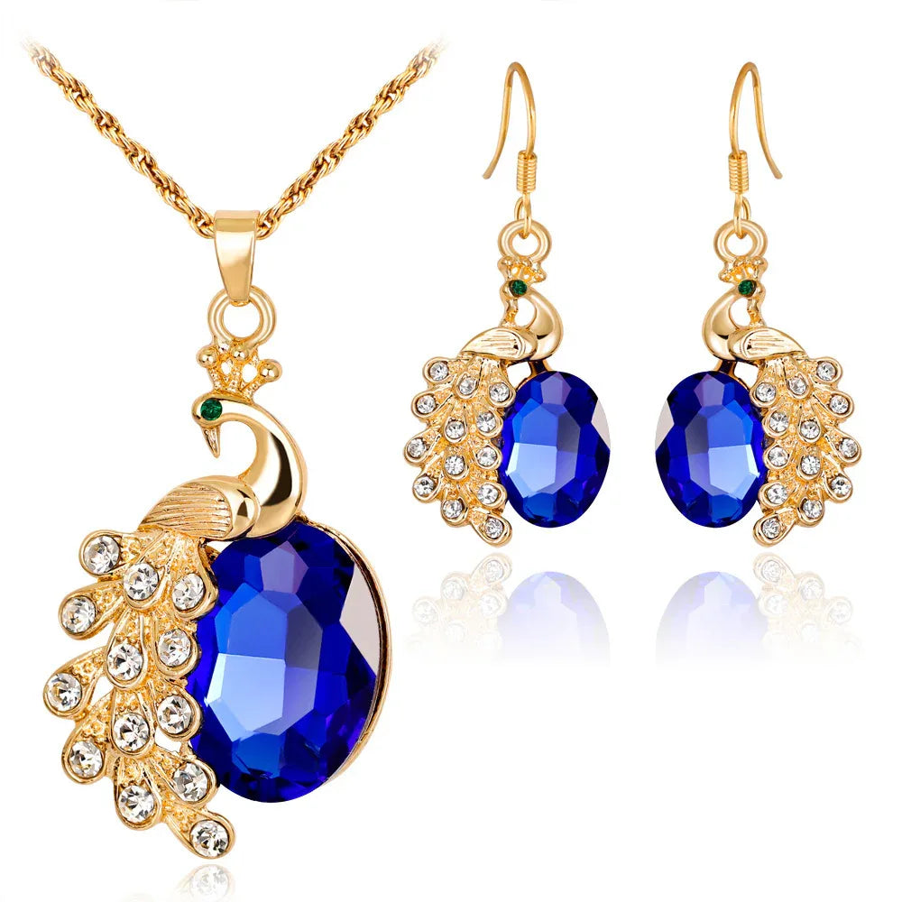 Parure de bijoux boucles d'oreilles et collier paon en strass