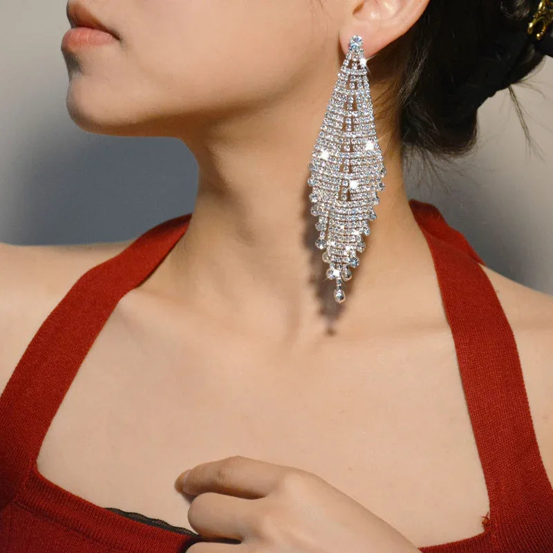 Boucles d'oreilles pendantes à pompons pour femme, style exagéré